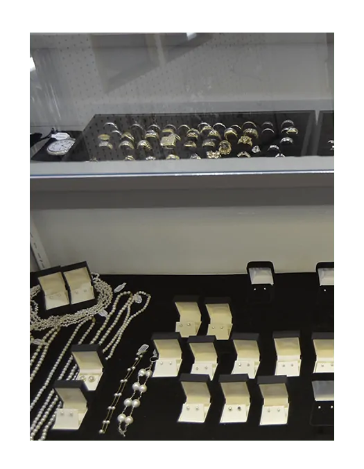 abt-what-else Jewelries in a glass-walled cabinet at Howards Pawn & Jewelry